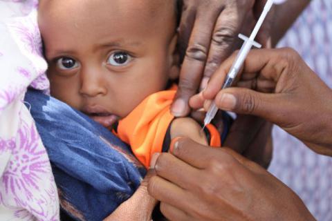A clinical nurse working at the Demdema health center that Save the Children supports, is giving a measles vaccine to a child at the end of Save the Children’s  “Catch-up vaccination campaign against Measles” advocacy meeting that marked the launch of regional vaccination campaign in Demdema in the Babille district of the Somali Region of Ethiopia