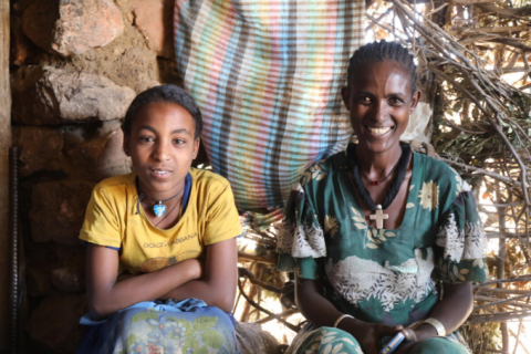 Zinash sitting with her mother in their home