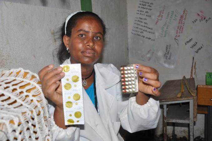 Maydaero school’s girls’ club coordinator Enda Hailu shows the methods of contraceptives that they teach at their office 