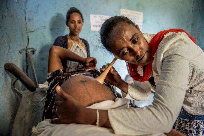 Balaynesh Siraw, 25, midwife nurse, works with Mantegbosh Wabet, 32, who is expecting   her fourth child. Mantegbosh lives in Yifag Kebele located in Libokemkem woreda, South Gonder of Amhara National regional state. 